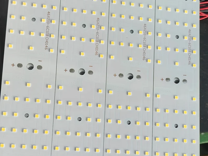 Aluminum LED circuit boards for flood lights, populated with rows of high-efficacy SMD LED chips